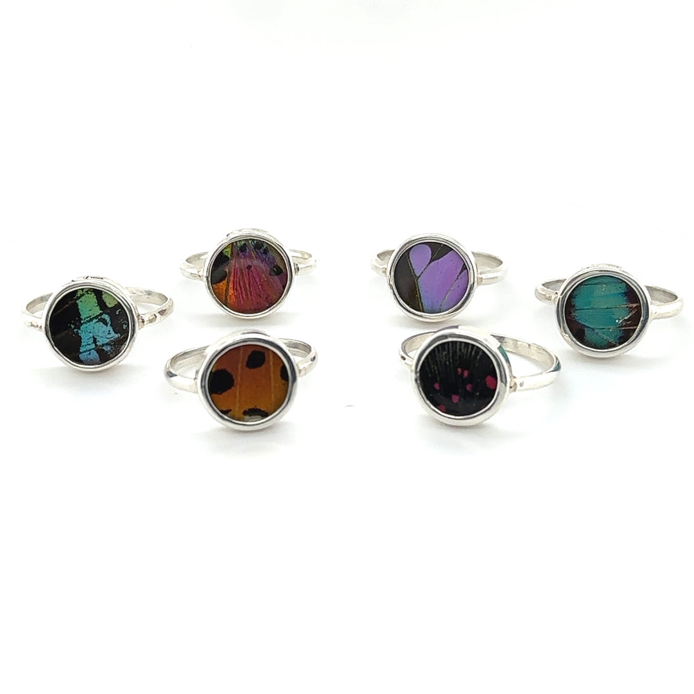 A statement set of Butterfly Wing Rings in Circle Shape with boho-inspired, different colored stones.