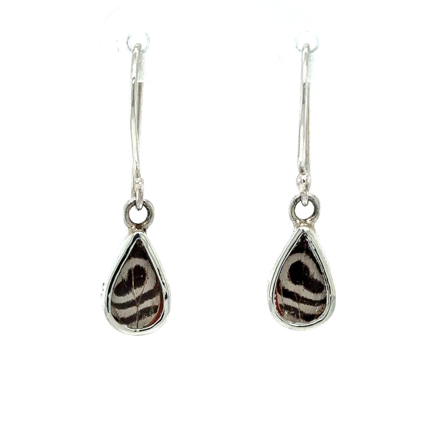 
                  
                    A statement pair of Small Butterfly Wing Earrings with a black and white pattern.
                  
                