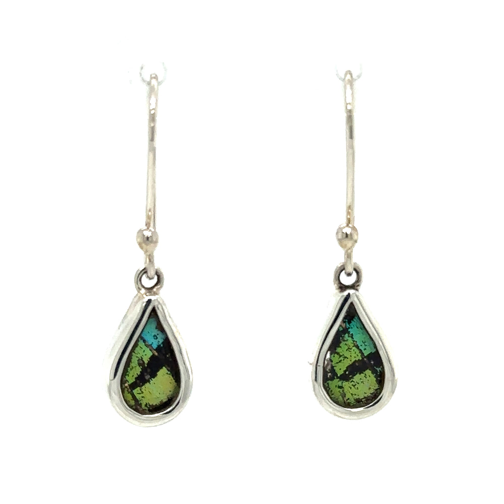
                  
                    These Small Butterfly Wing Earrings by Super Silver feature a green and black stone, crafted from sterling silver. Inspired by the beauty of the Peruvian Amazon and handmade sustainably at a butterfly farm.
                  
                