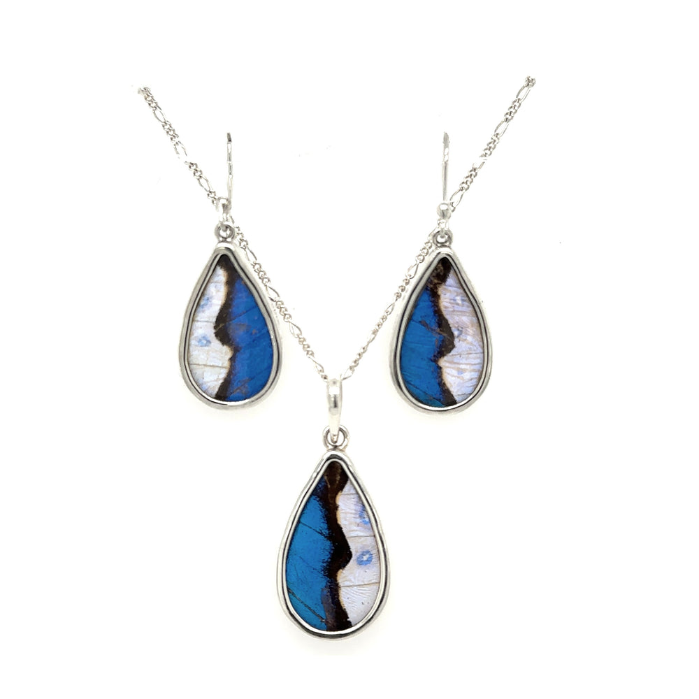 A genuine butterfly pendant and earring teardrop set with sterling silver accents.