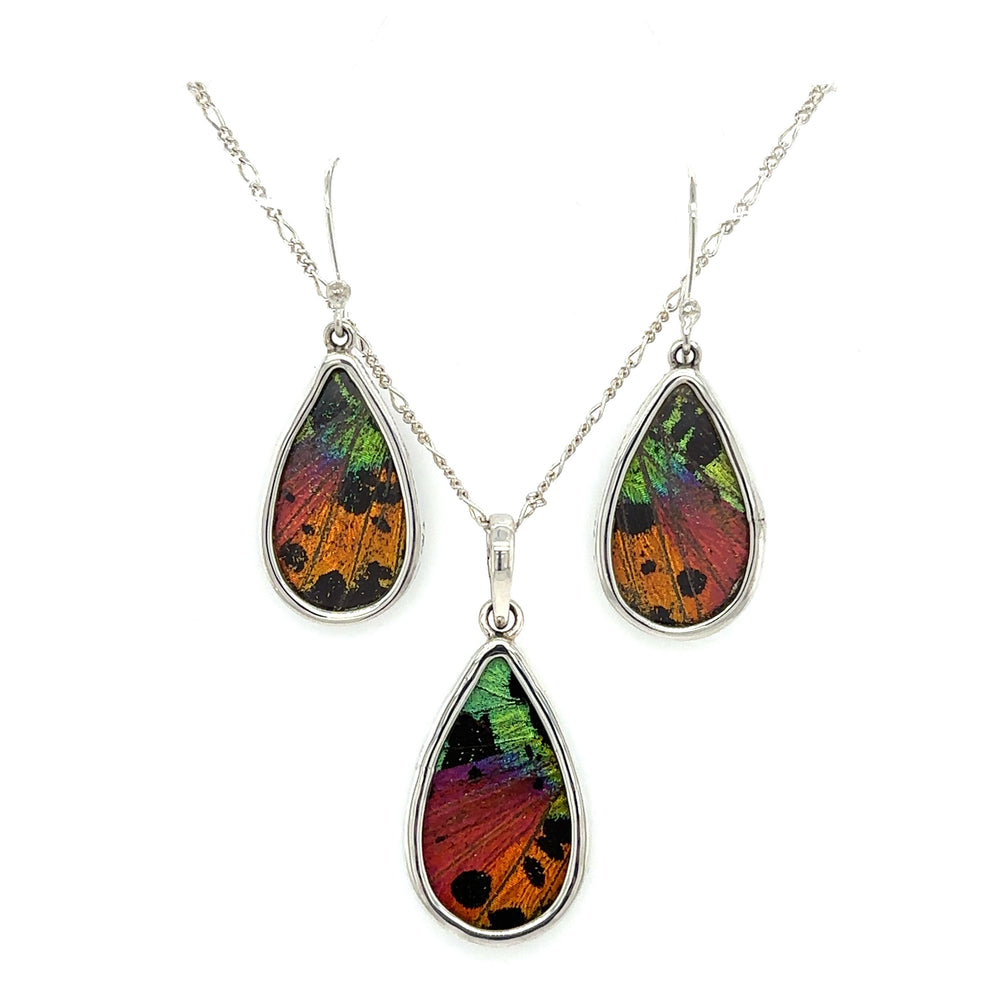 A statement-worthy Genuine Butterfly Pendant and Earring Teardrop Set in vibrant colors, perfect for boho lovers or those seeking a touch of Santa Cruz style.