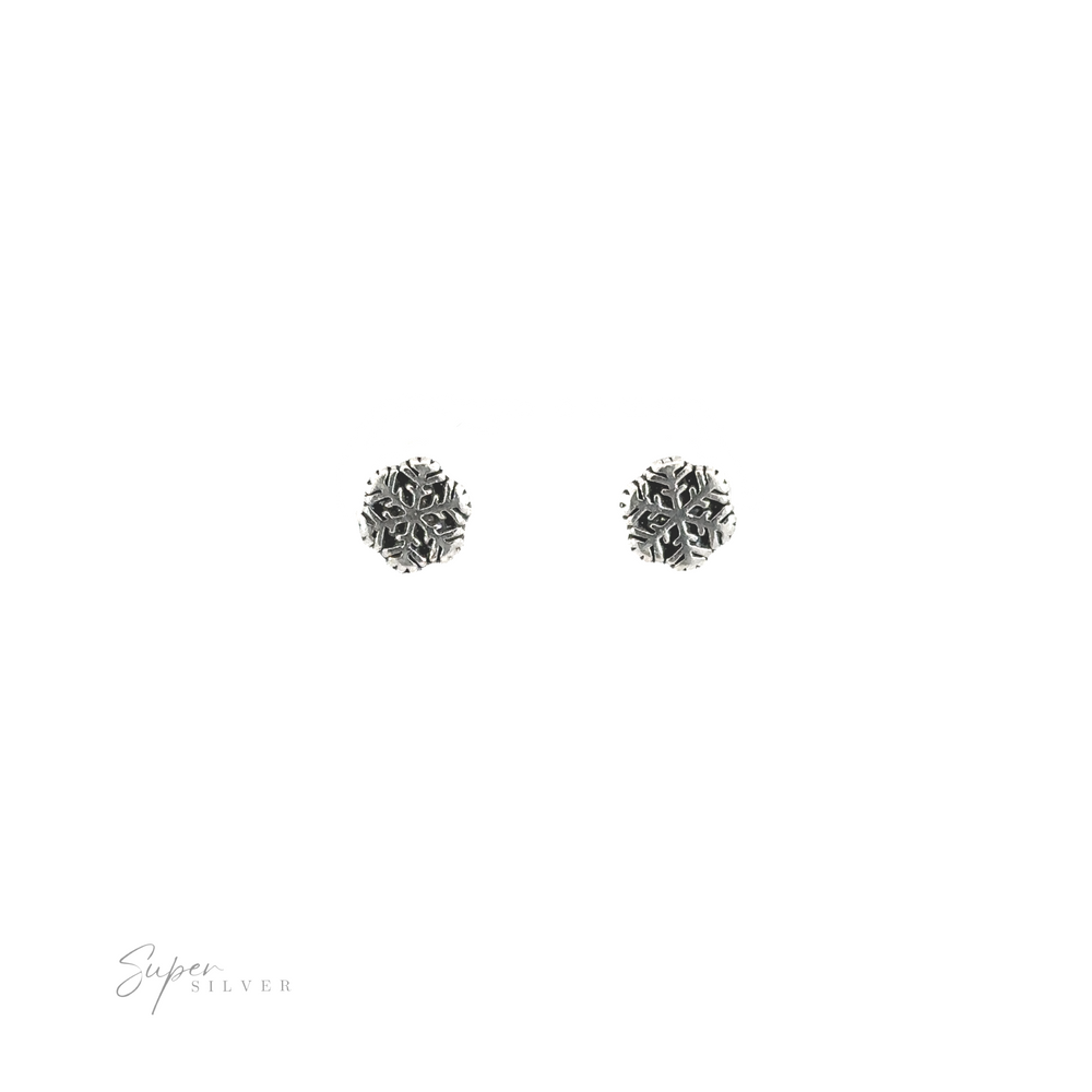 
                  
                    A pair of silver Snowflake Studs, perfect for winter style.
                  
                