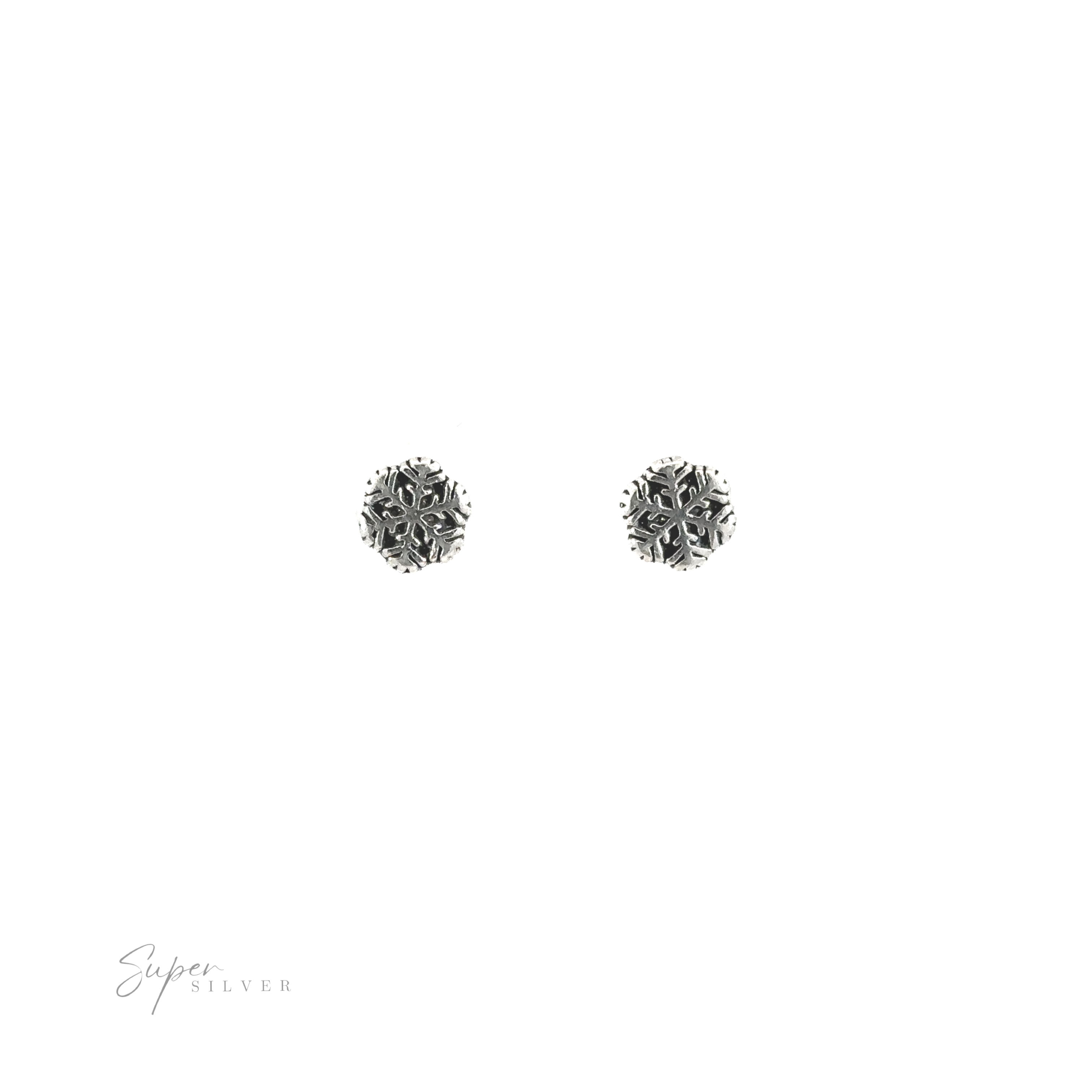 A pair of silver Snowflake Studs, perfect for winter style.