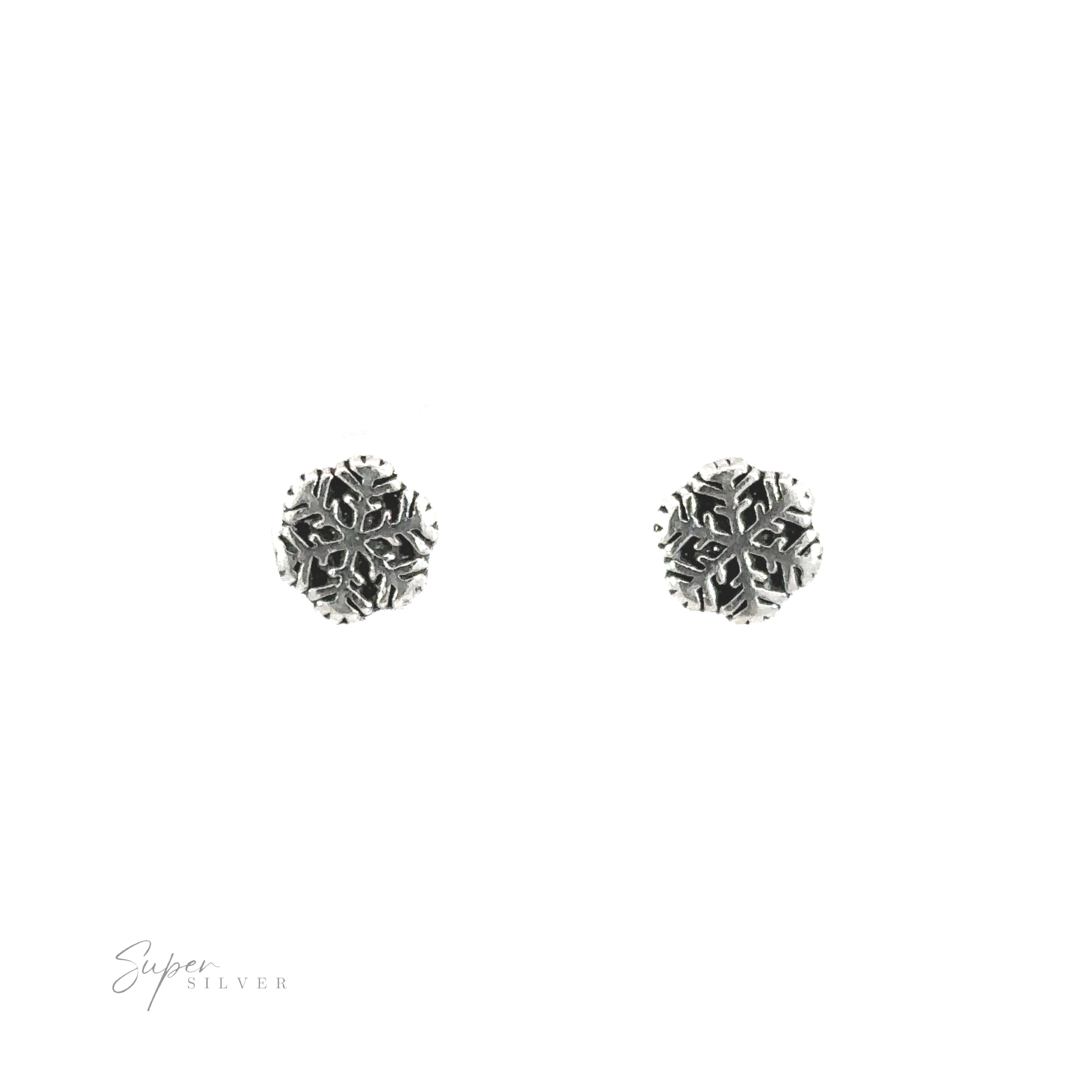 A pair of silver Snowflake Studs with snowflake motifs on a white background.