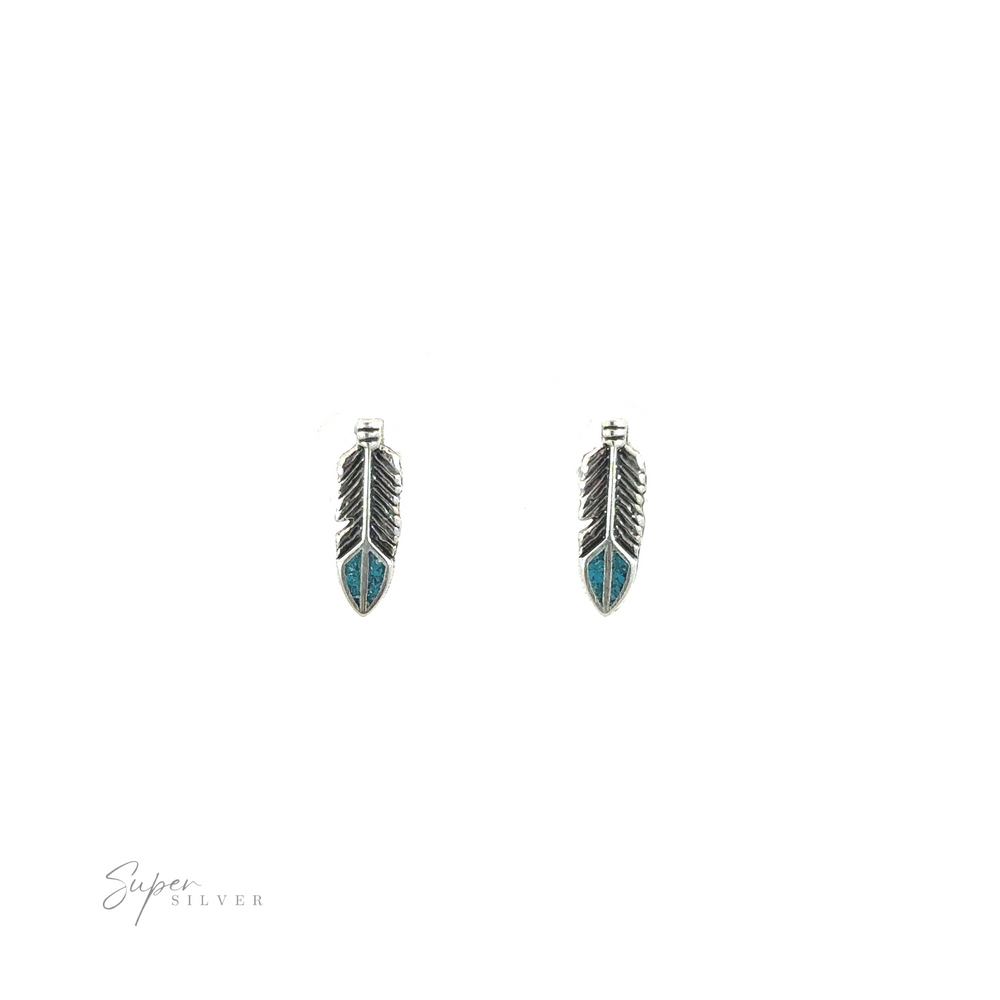 
                  
                    A pair of southwestern-inspired Feather Studs with Turquoise on a white background.
                  
                