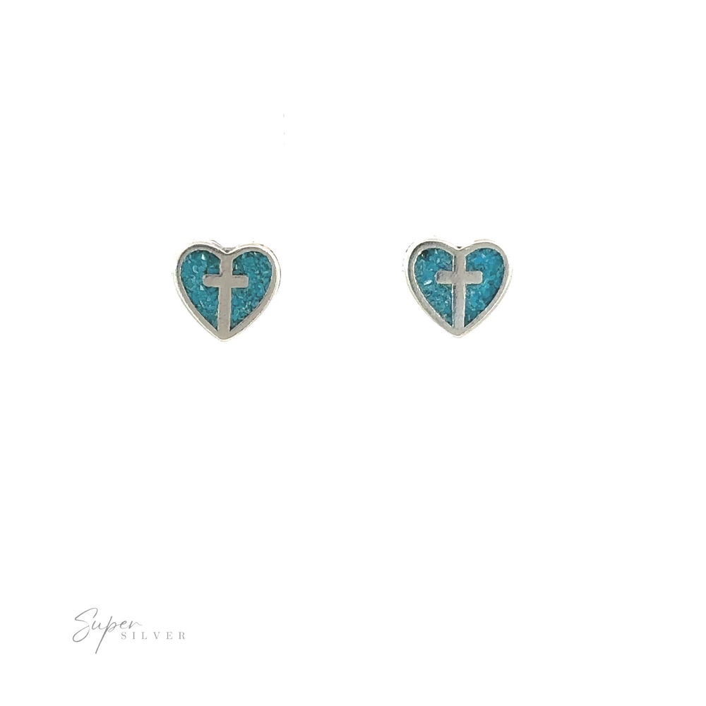 
                  
                    A pair of Turquoise Heart Studs with Silver Cross featuring heart shaped Christian cross jewelry.
                  
                
