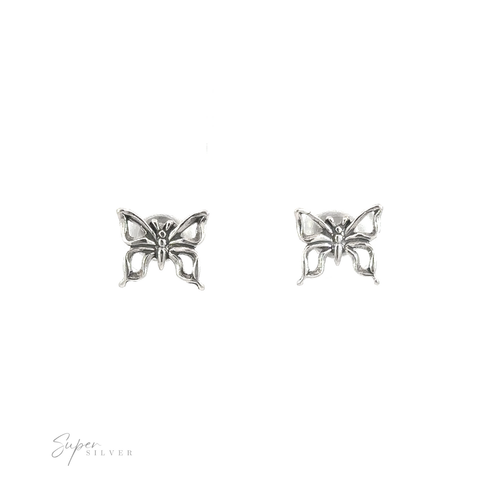 A minimalist pair of Butterfly Outline Studs on a white background, perfect for nature enthusiasts.