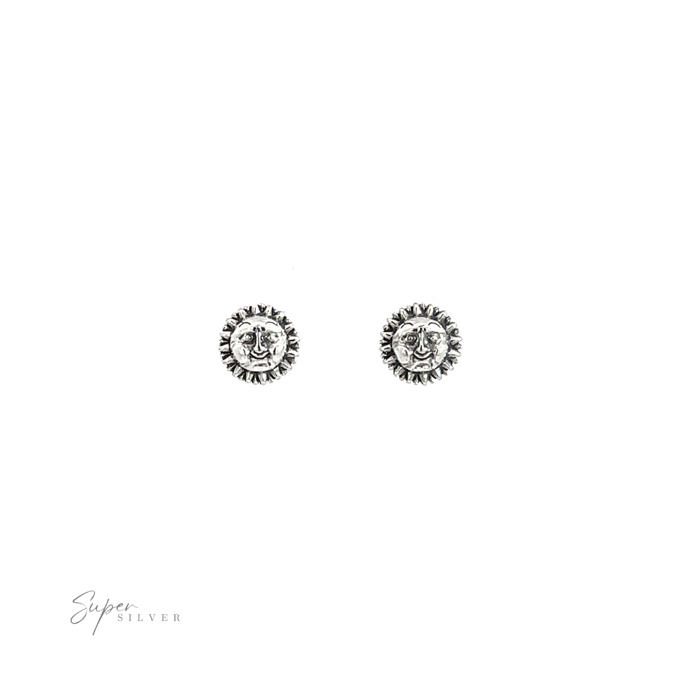
                  
                    A pair of Sun with Face Studs.
                  
                