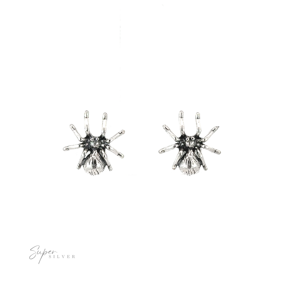 A pair of Spider Studs on a white background.