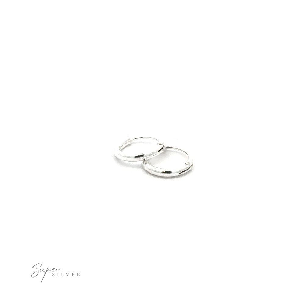 
                  
                    1.2mm Infinity Hoops with a minimalist flair on a white background.
                  
                