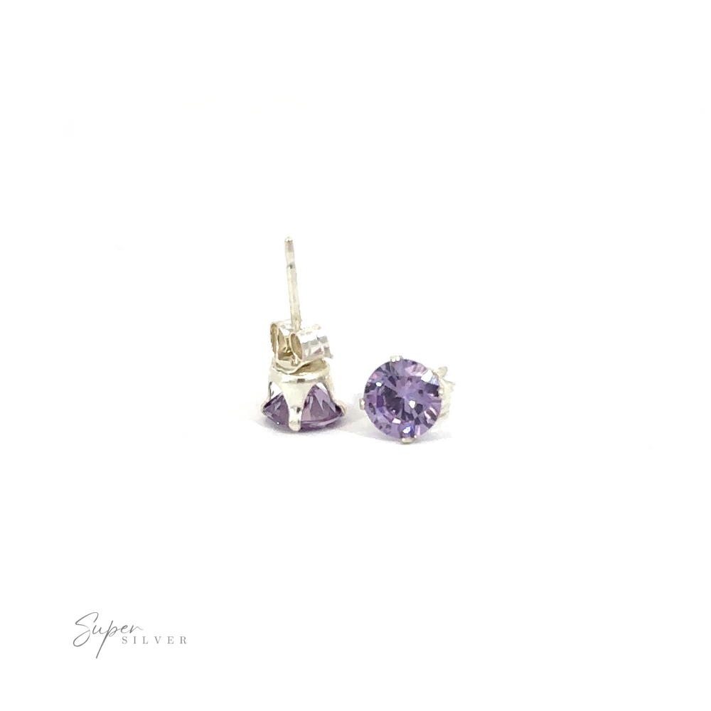 
                  
                    A pair of Round CZ Stud earrings with purple cubic zirconia gemstones on a white background.
                  
                