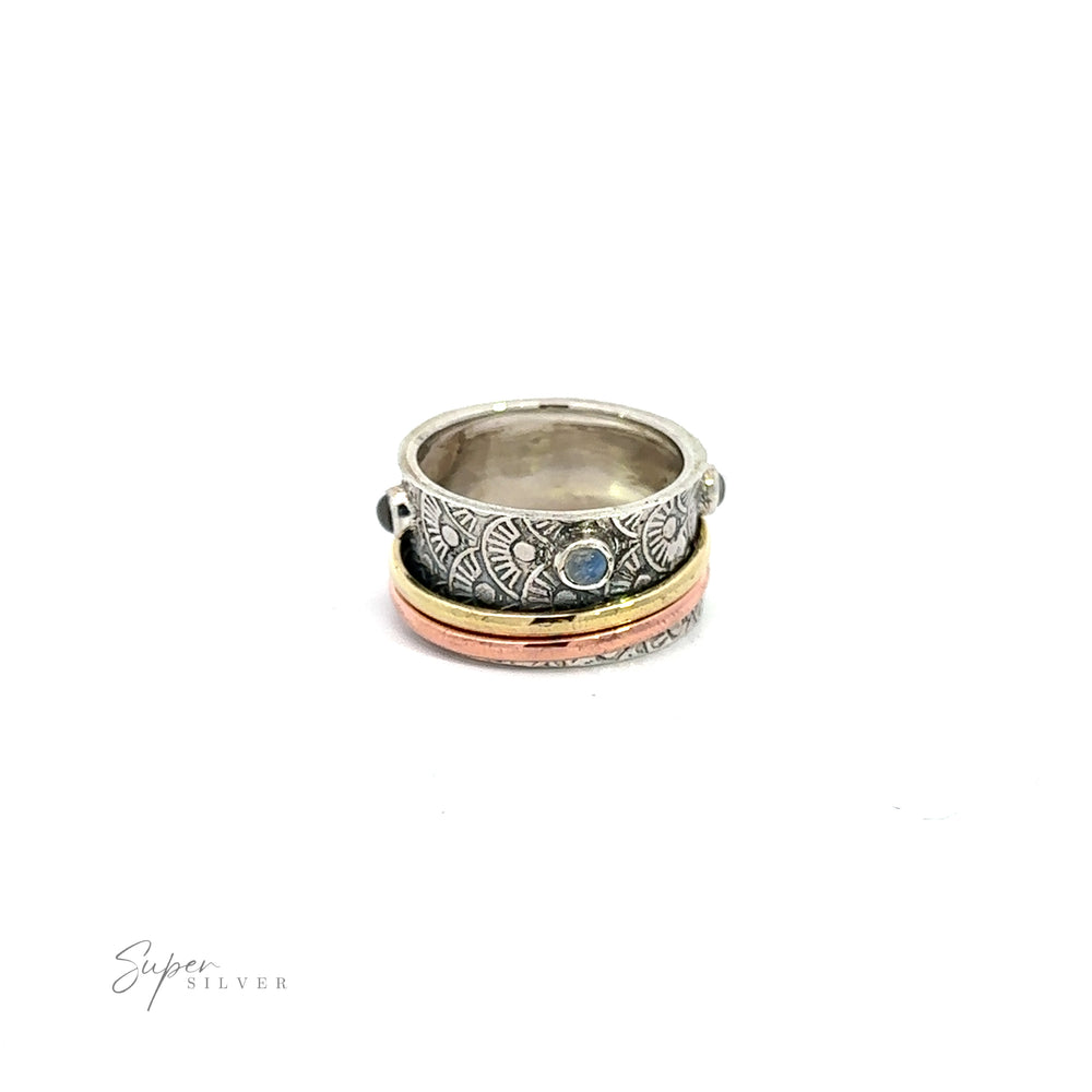 
                  
                    A Handmade Tricolor Spinner Ring with Moonstone Accents .925 Sterling Silver ring with a blue moonstone.
                  
                