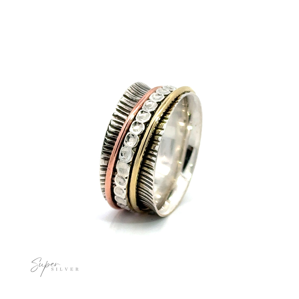 A Handmade Tricolor Etched Spinner Ring with a spiral design, featuring etched wide bands and textured metal bands.