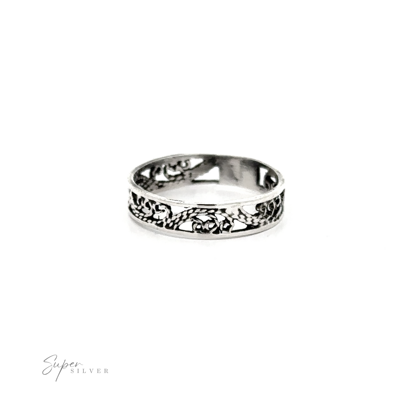 A Freestyle Filigree Band with etched floral designs on a silver band.