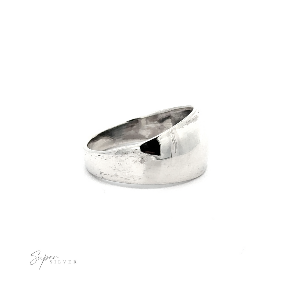 
                  
                    A contemporary silver dome ring on a white background.
                  
                