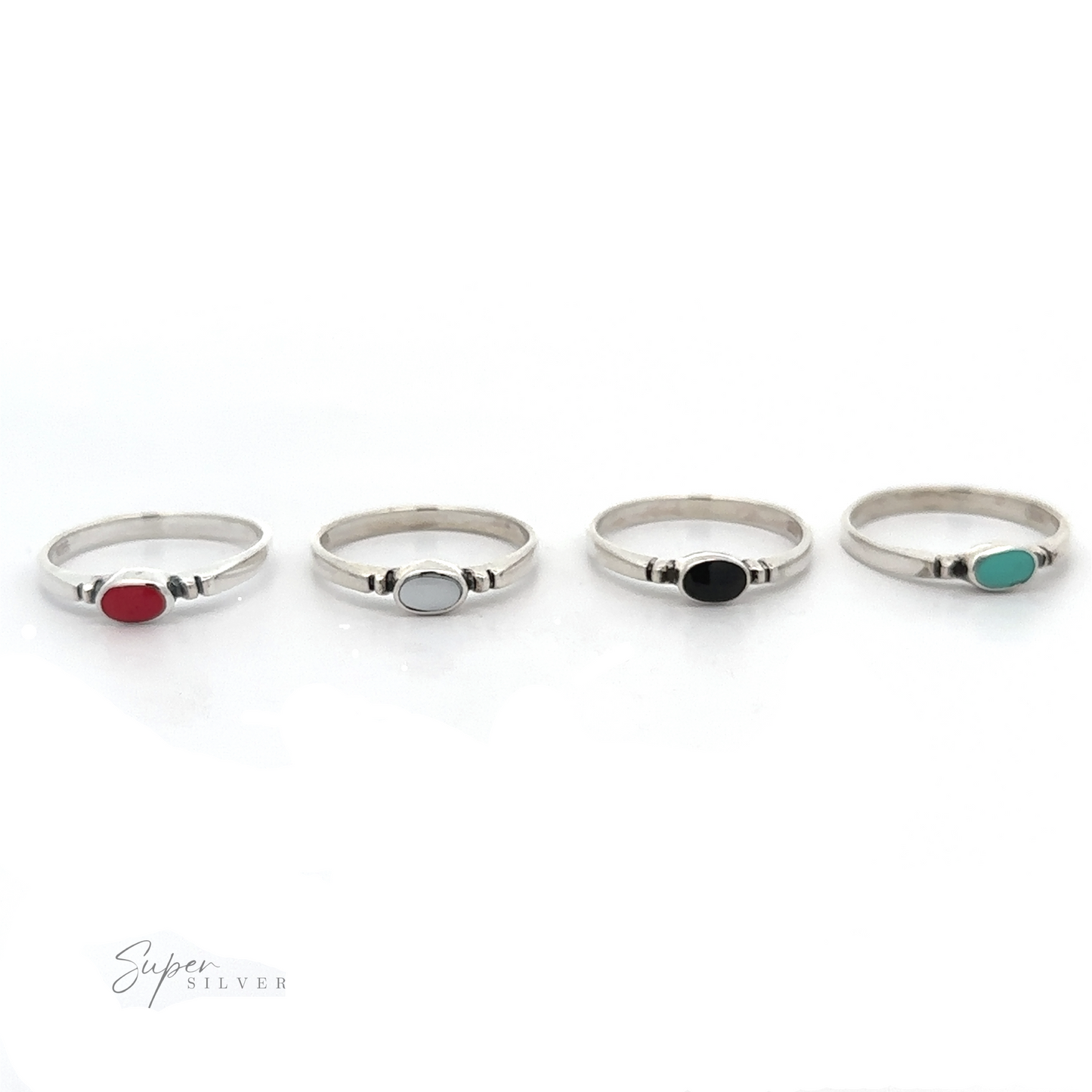 
                  
                    A set of four Small Horizontal Oval Inlay Rings with dainty and sleek designs featuring different colored stones.
                  
                