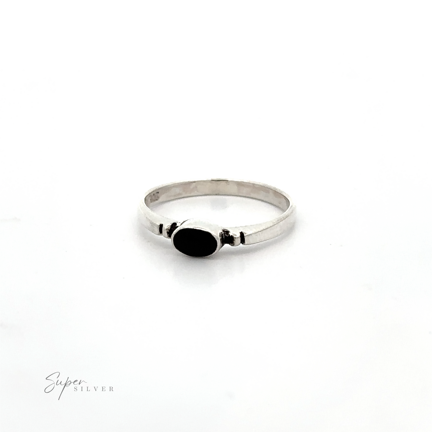 
                  
                    A Small Horizontal Oval Inlay Ring with notched details on a white background.
                  
                