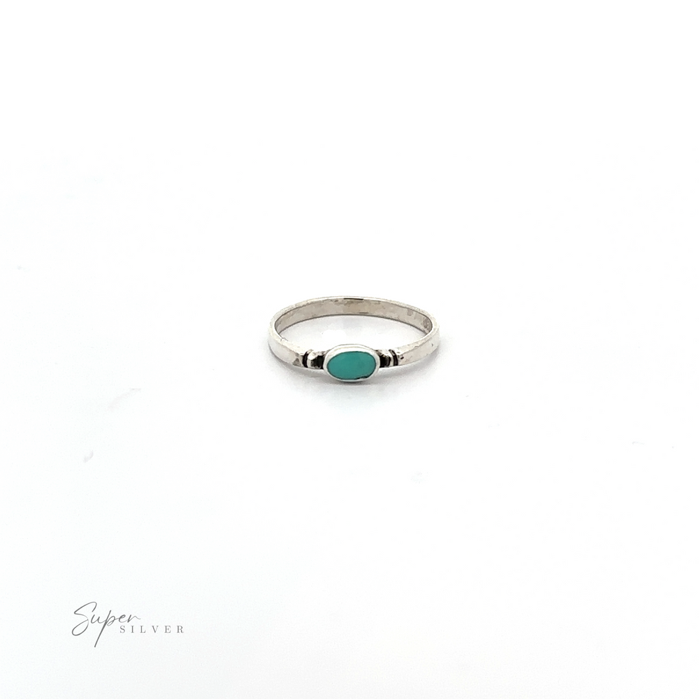 
                  
                    A dainty and sleek Small Horizontal Oval Inlay Ring with a turquoise stone.
                  
                