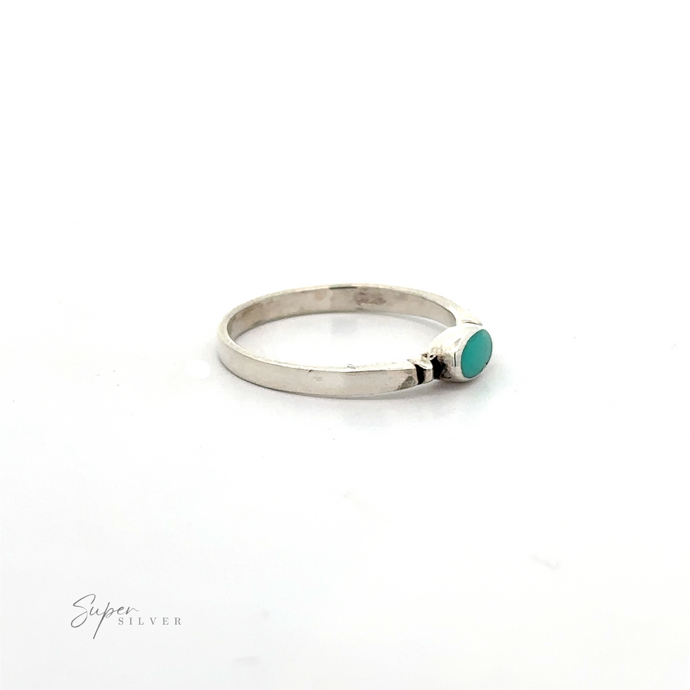 
                  
                    A dainty and sleek sterling silver Small Horizontal Oval Inlay Ring with a sideways oval turquoise stone.
                  
                