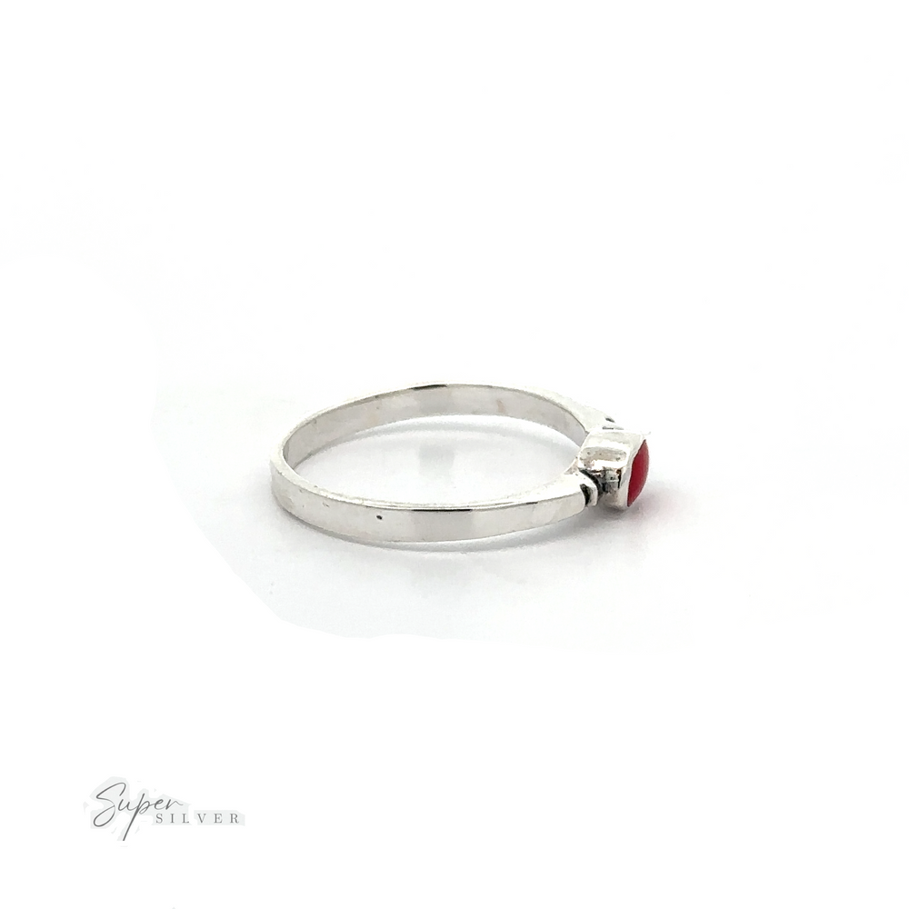 
                  
                    A dainty Small Horizontal Oval Inlay Ring with a sleek design and a red stone.
                  
                