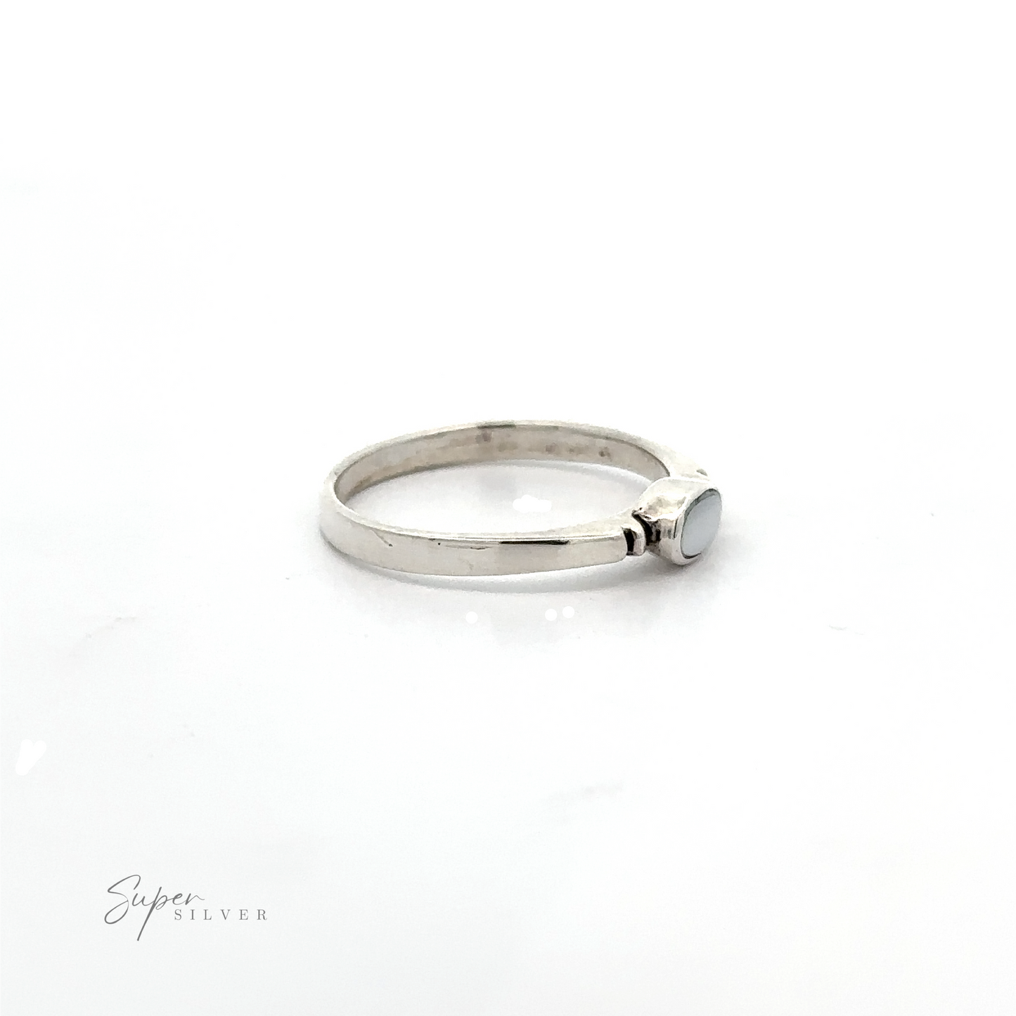 
                  
                    A dainty and sleek Small Horizontal Oval Inlay Ring with a sideways oval blue stone.
                  
                