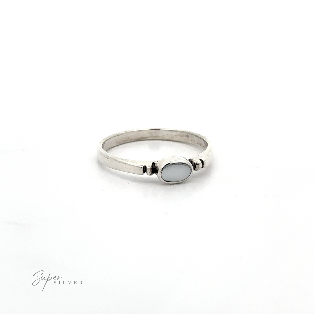 
                  
                    A dainty sterling silver Small Horizontal Oval Inlay Ring with a sleek design and a blue stone.
                  
                