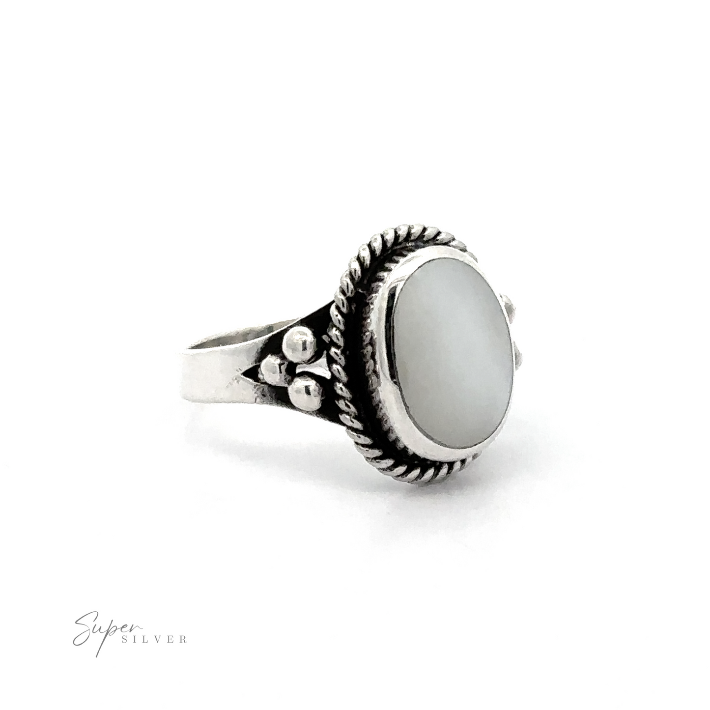 
                  
                    A Oval Ring with Rope Setting and Inlaid Stones ring with an inlaid white stone.
                  
                