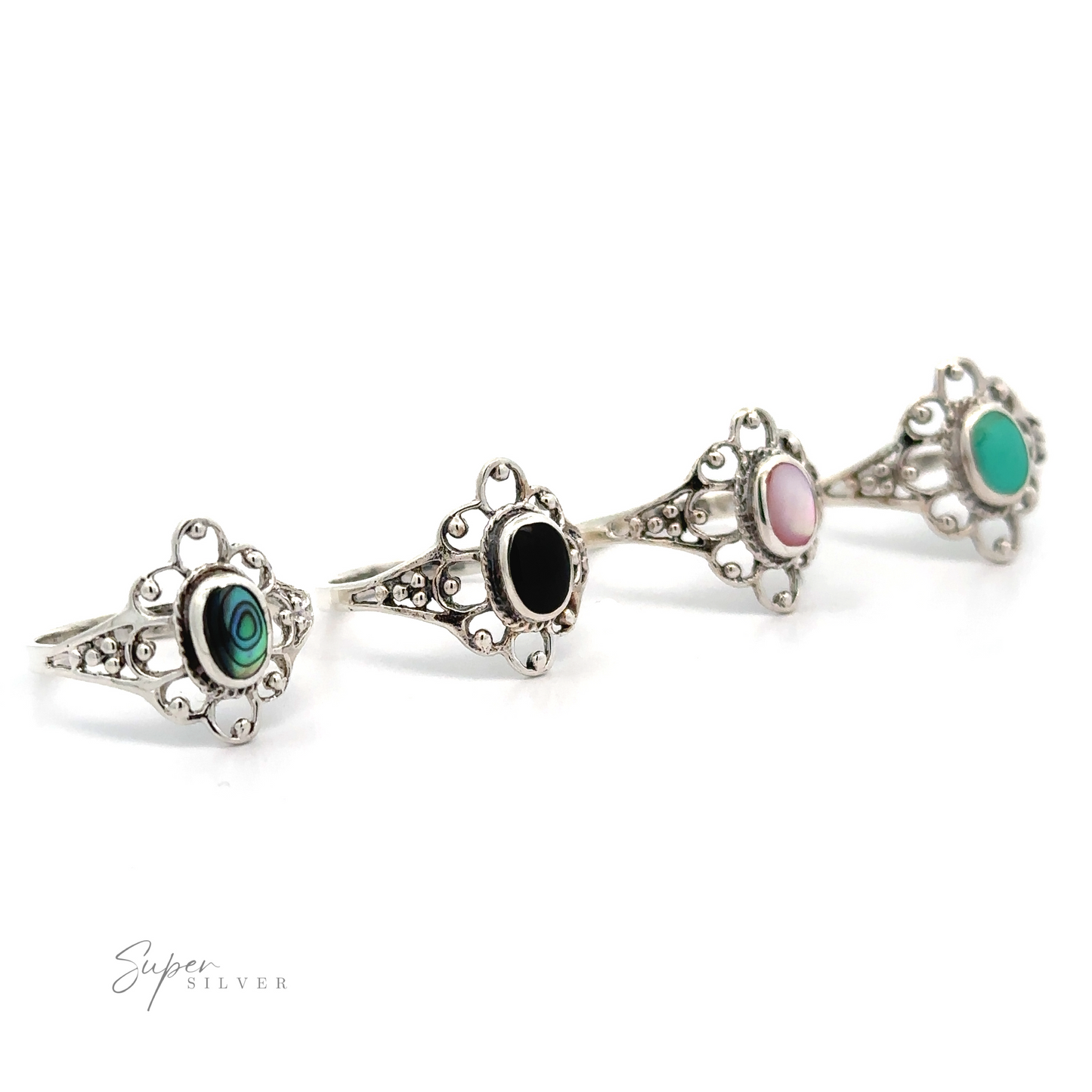 A row of Vintage-Styled Flower Rings with Inlaid Stones, each exuding vintage appeal with lacy petals.