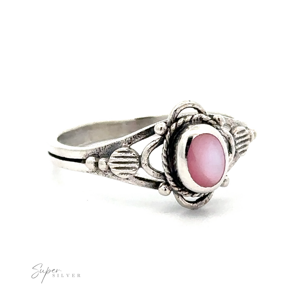 
                  
                    This Fancy Oval Inlay Stone Ring features a pink stone, giving it a vintage touch.
                  
                