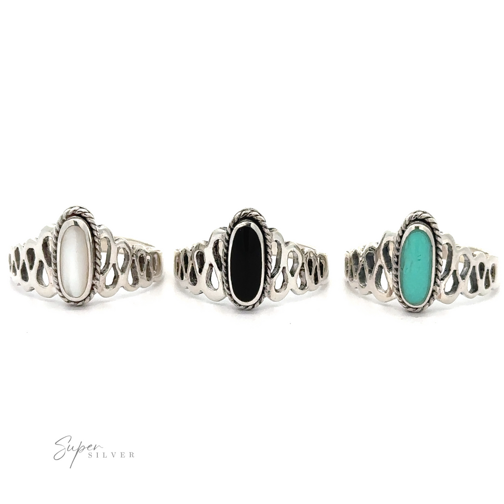 
                  
                    Three Oval Inlaid Stone Rings with turquoise and black inlaid stones.
                  
                