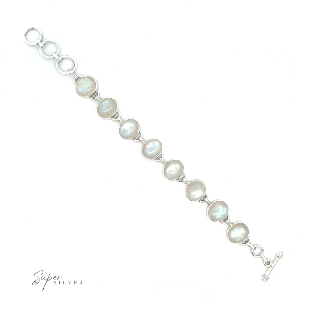 
                  
                    Statement Oval Gemstone Bracelets featuring oval moonstones set in a simple link design, with a toggle clasp, on a white background, described as a moonstone bracelet.
                  
                