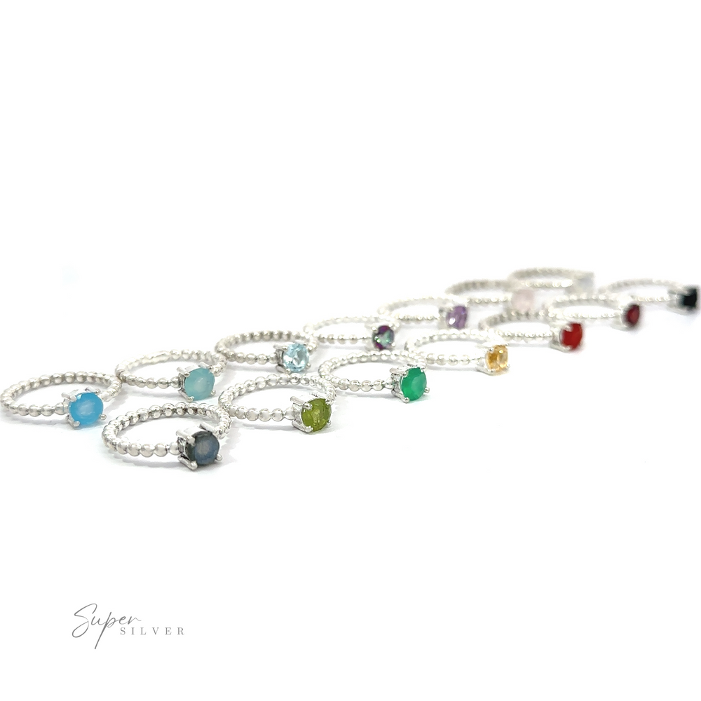 A collection of sterling silver bracelets with various colored gemstones on a white background.