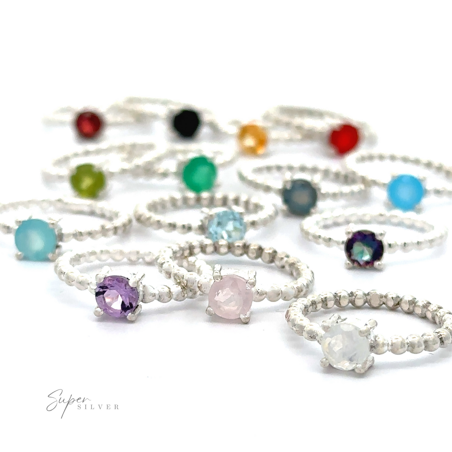 An assortment of Stunning Circular Gemstone Rings with Beaded Bands displayed against a white background.