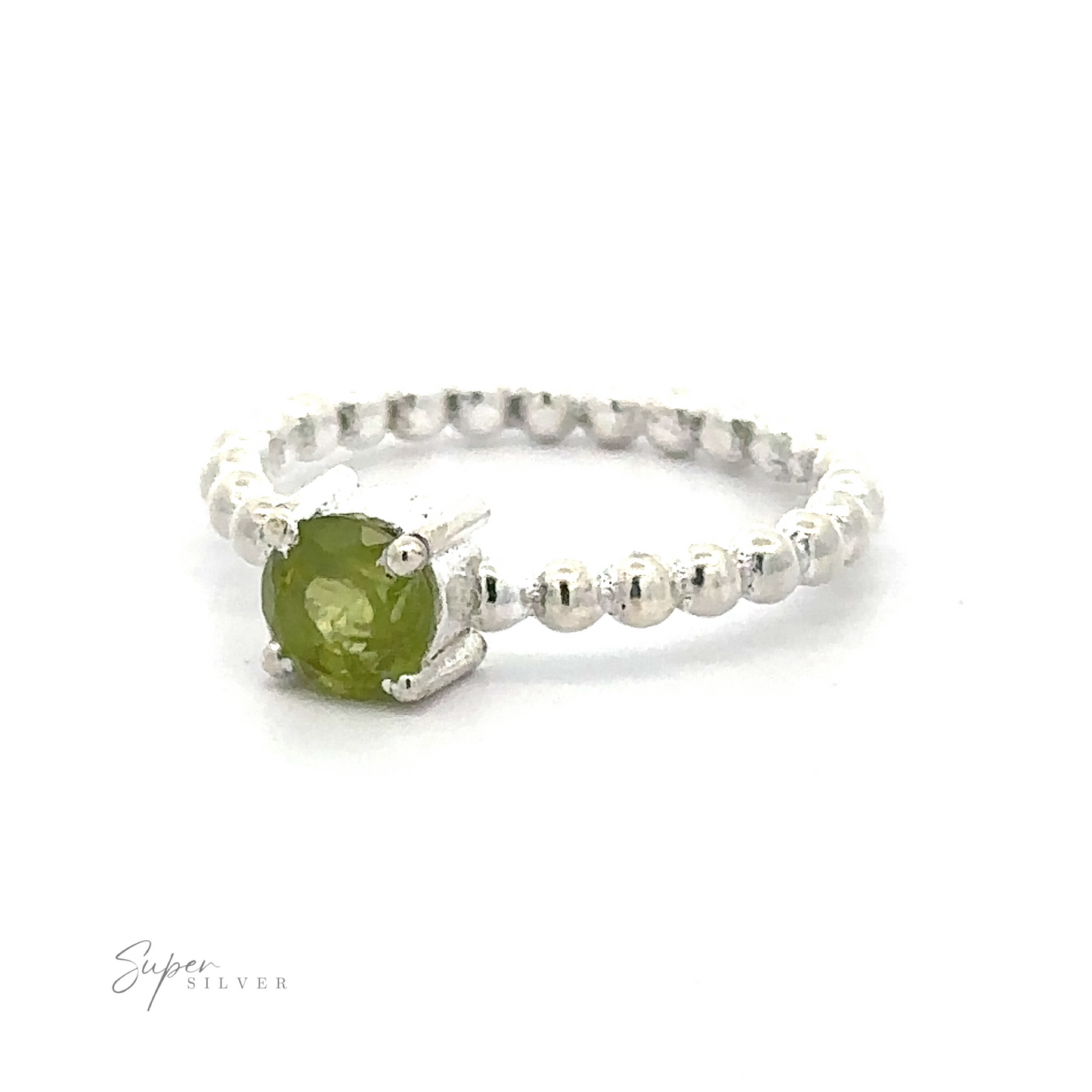 
                  
                    Stunning Circular Gemstone Ring with Beaded Band with a green gemstone on a white background.
                  
                