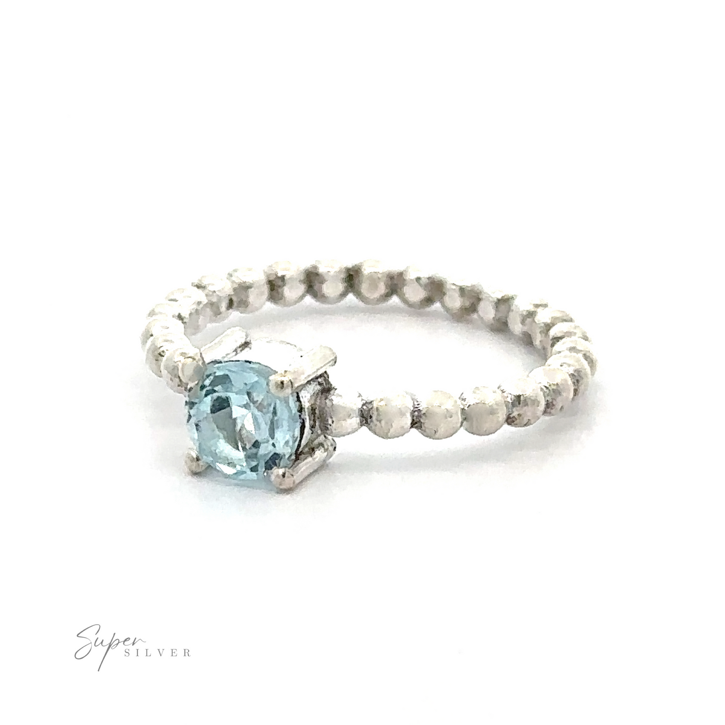 
                  
                    A stunning circular gemstone ring with a single vibrant blue gemstone set in a prong setting on a textured band.
                  
                