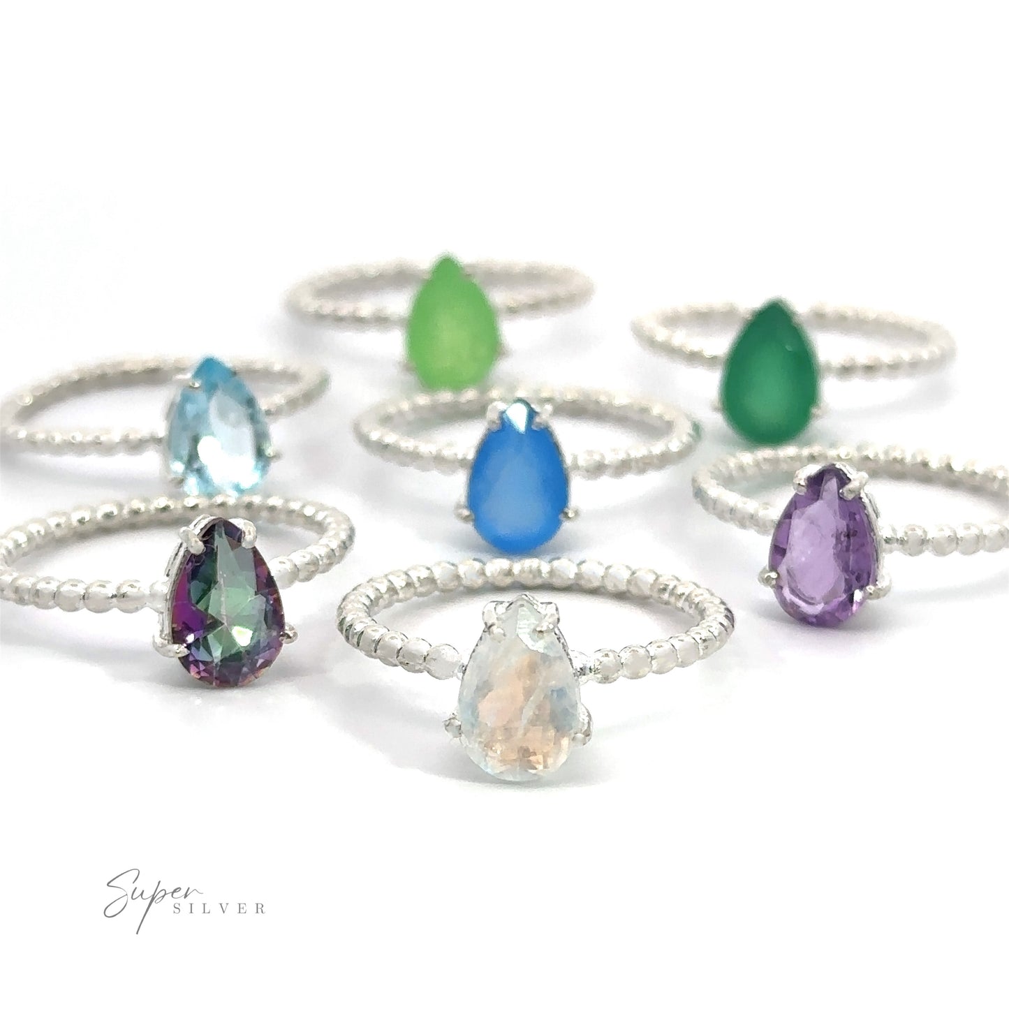 
                  
                    An assortment of Vibrant Teardrop Gemstone rings with Beaded Band on a white background.
                  
                