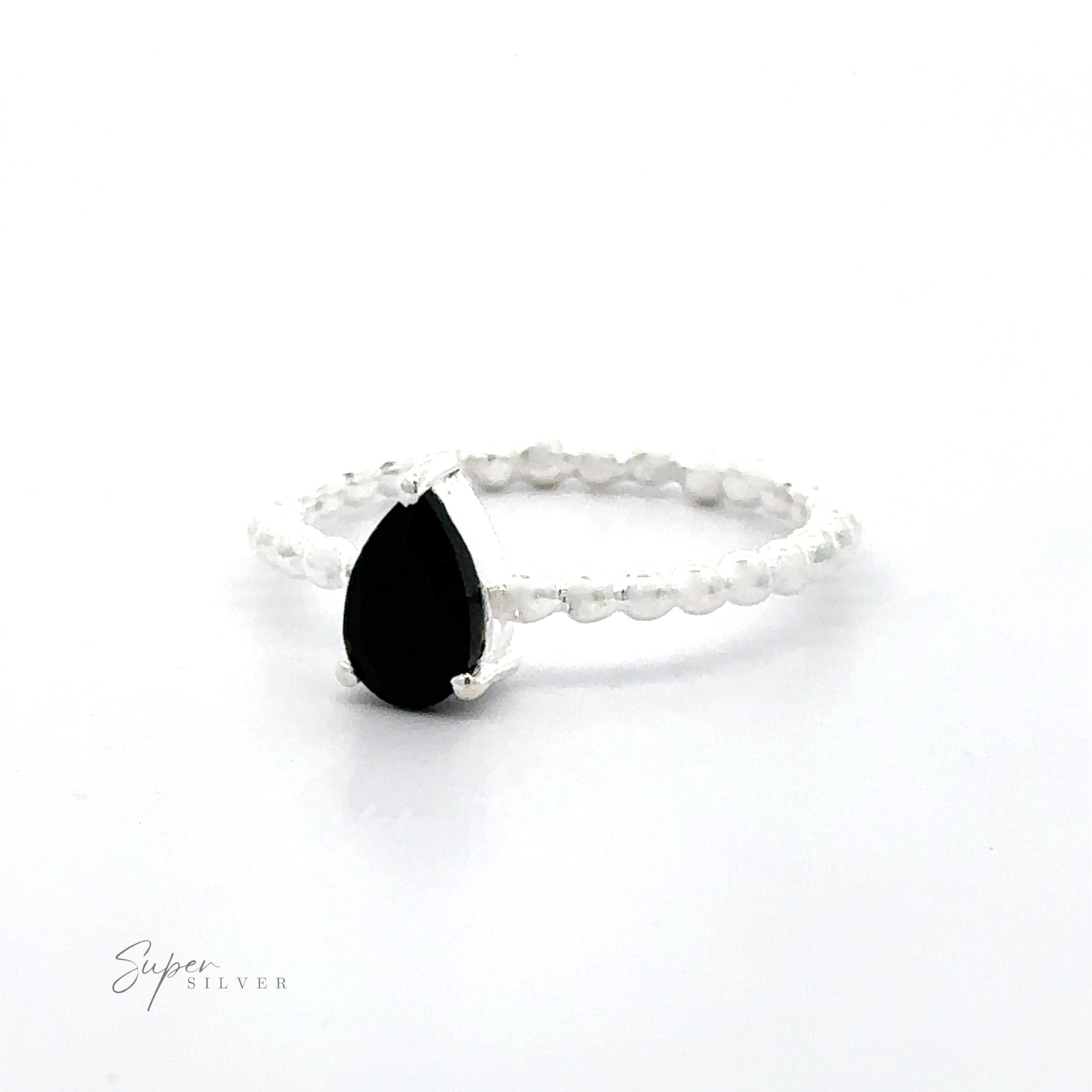 .925 Sterling Silver ring with a Sparkling Teardrop Gemstone on Beaded Band in a prong setting on a white background.
