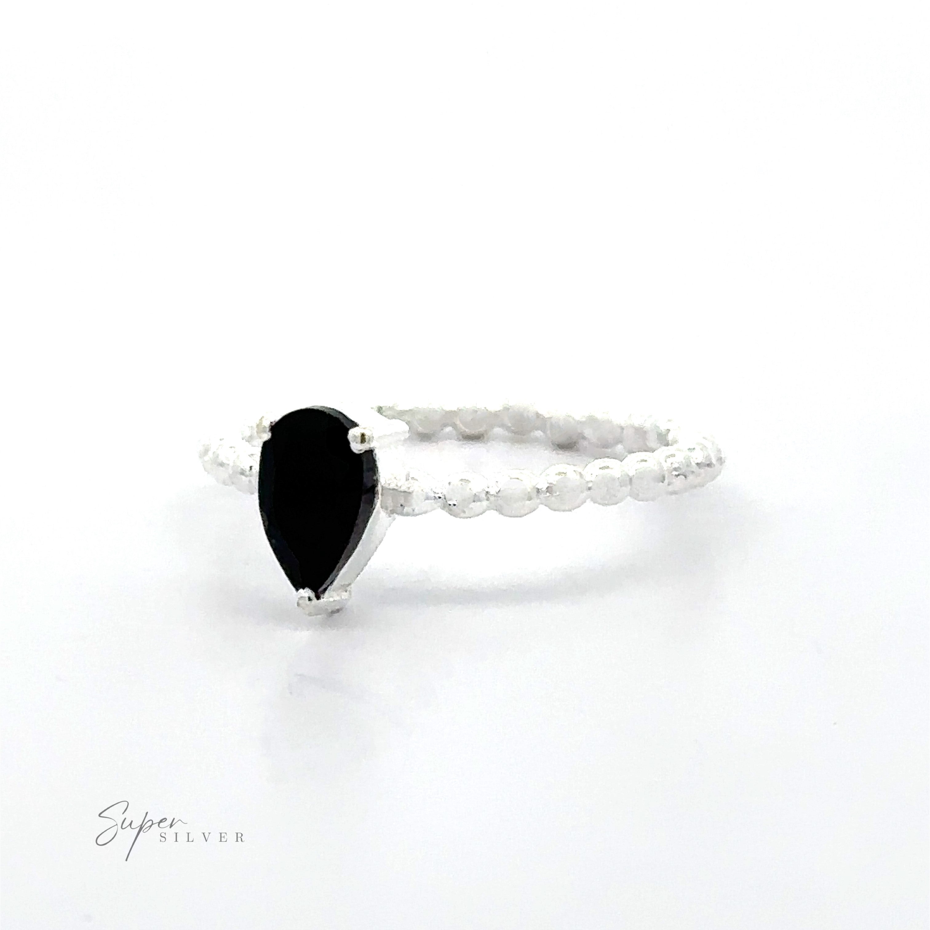 Silver Sparkling Teardrop Gemstone on Beaded Band ring on a white background.