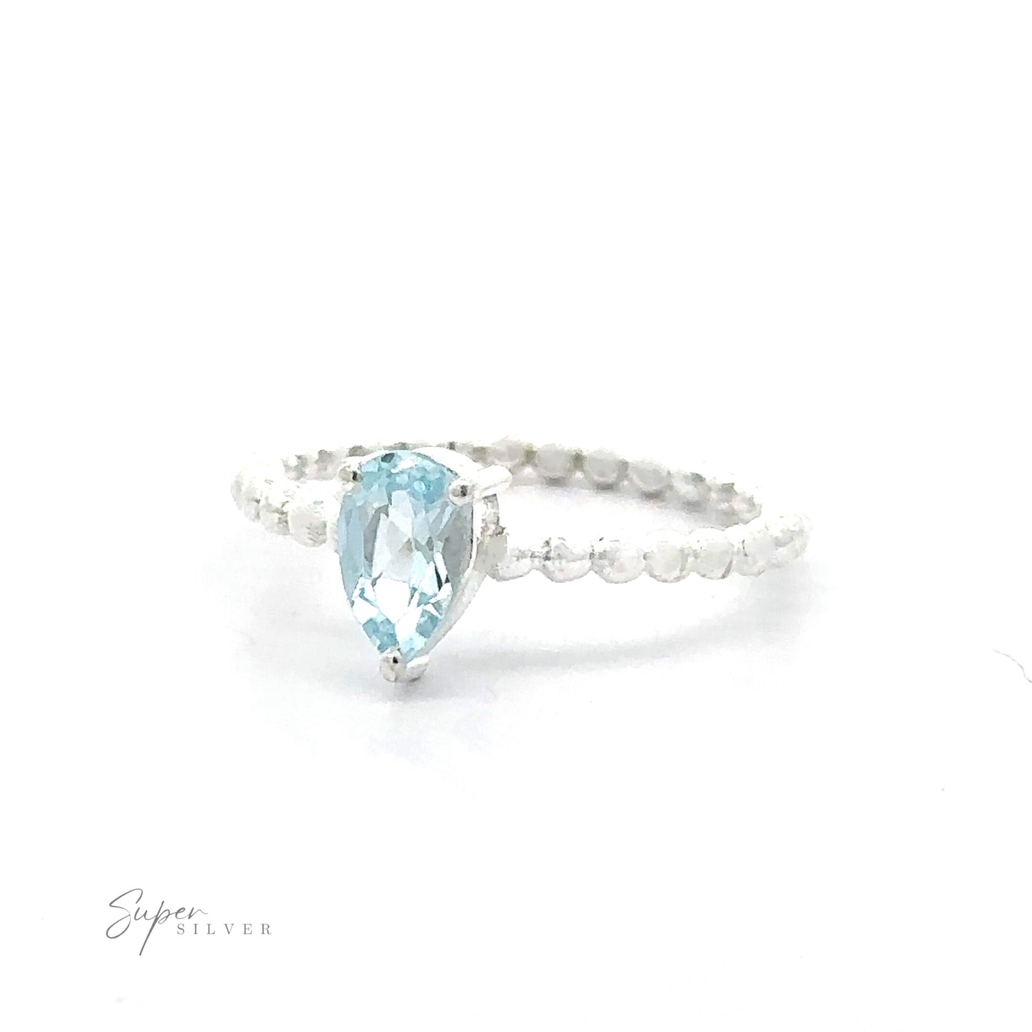 
                  
                    A .925 sterling silver ring with a Sparkling Teardrop Gemstone on Beaded Band and smaller clear crystals on the band.
                  
                
