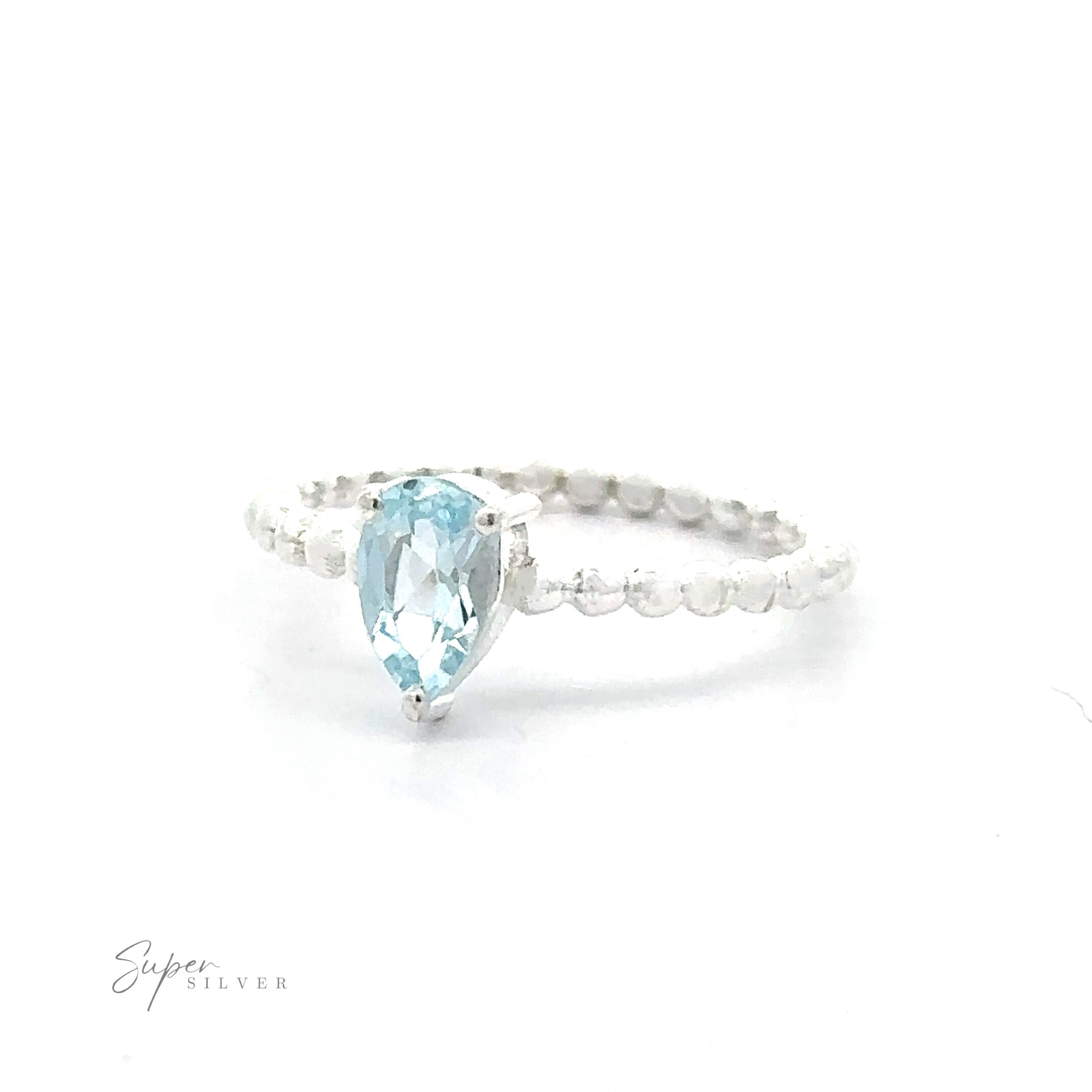 A .925 sterling silver ring with a Sparkling Teardrop Gemstone on Beaded Band and smaller clear crystals on the band.
