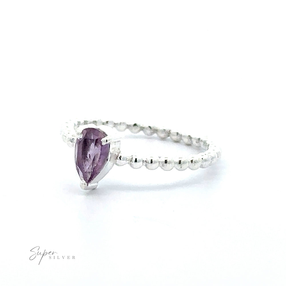 
                  
                    A Sparkling Teardrop Gemstone on Beaded Band ring displayed against a white background.
                  
                