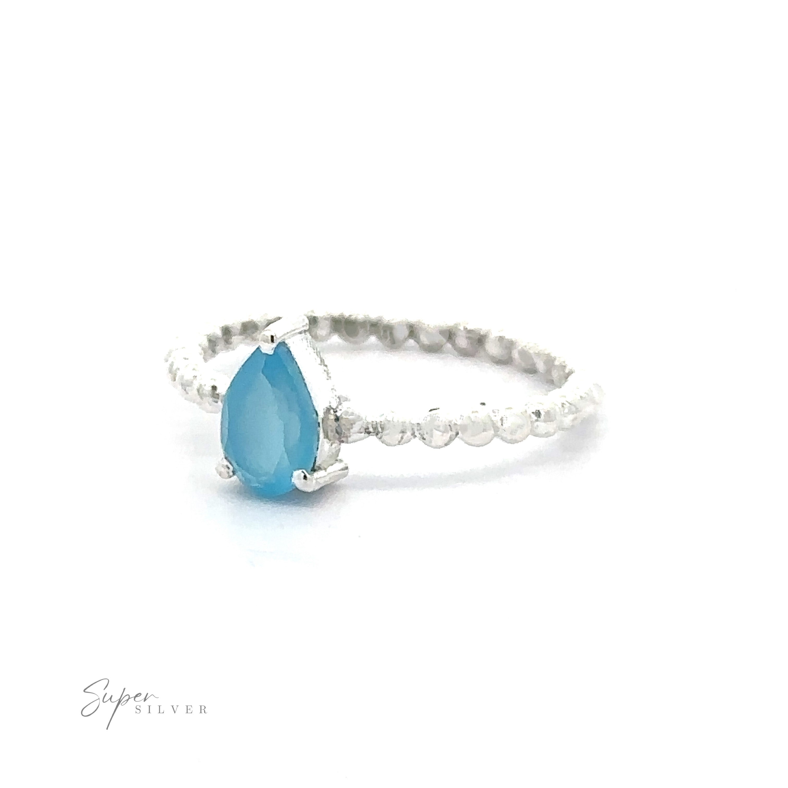 Sparkling Teardrop Gemstone on Beaded Band with a pear-shaped blue gemstone in a prong setting on a white background.