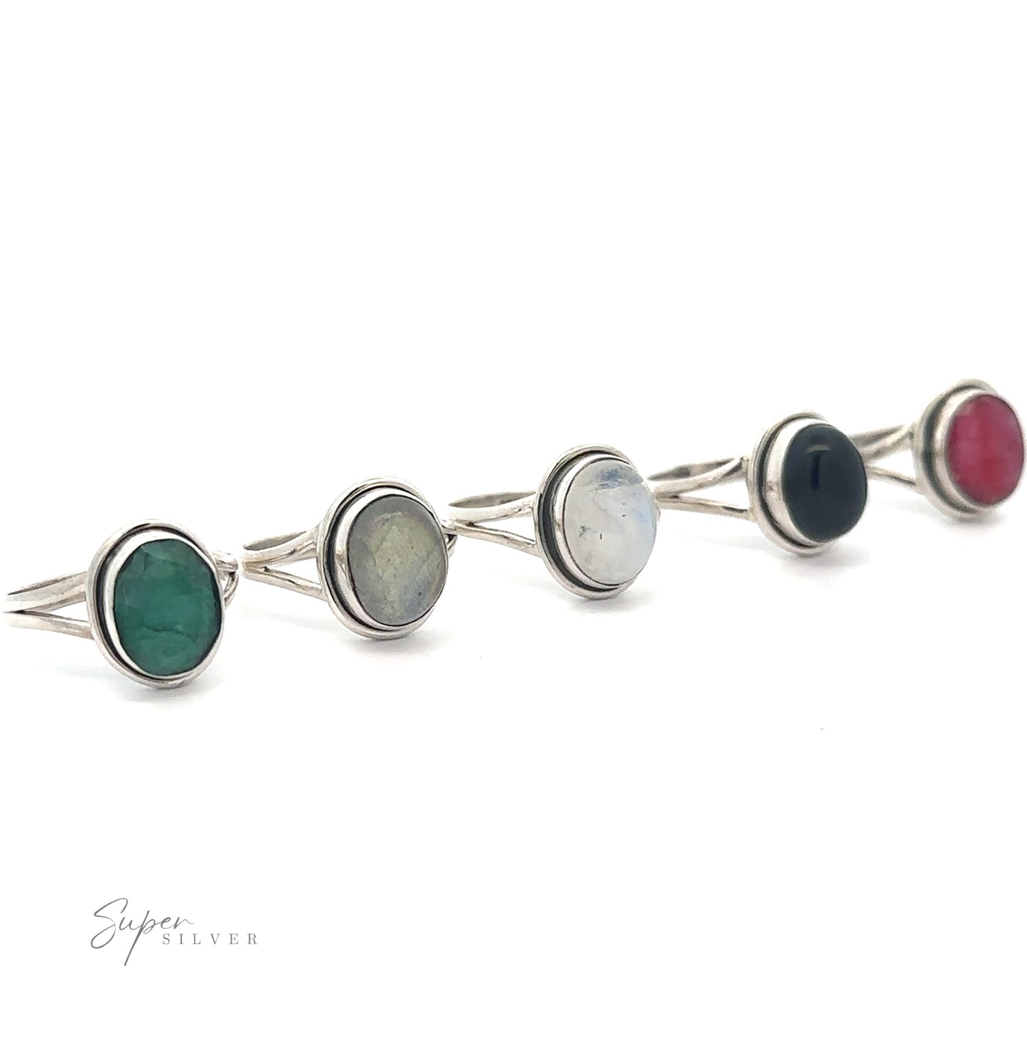 Four sterling silver Oval Split Shank Stone Rings with assorted gemstones, displayed in a row against a white background.