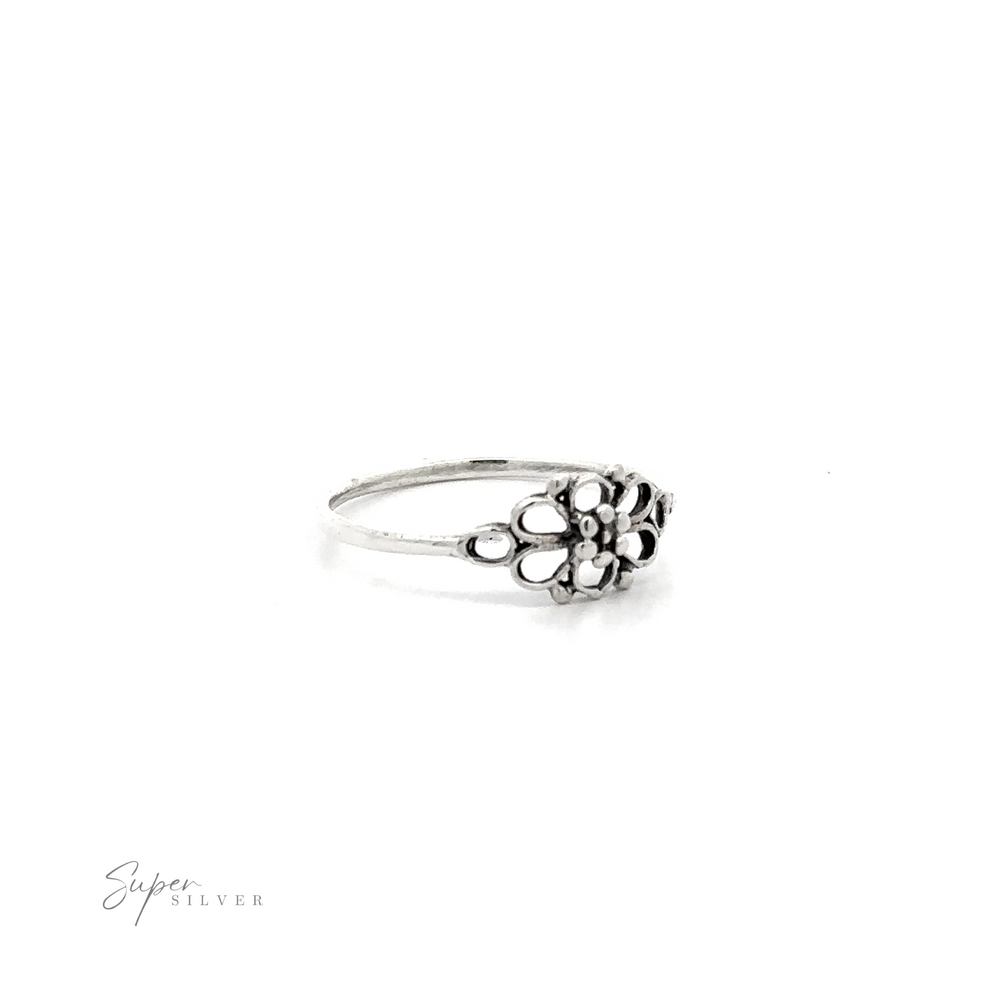 Petite Open Flower sterling silver ring on a white background.