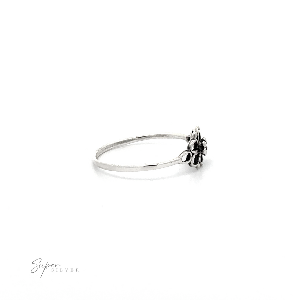 
                  
                    Petite Open Flower Ring with floral design on a white background.
                  
                