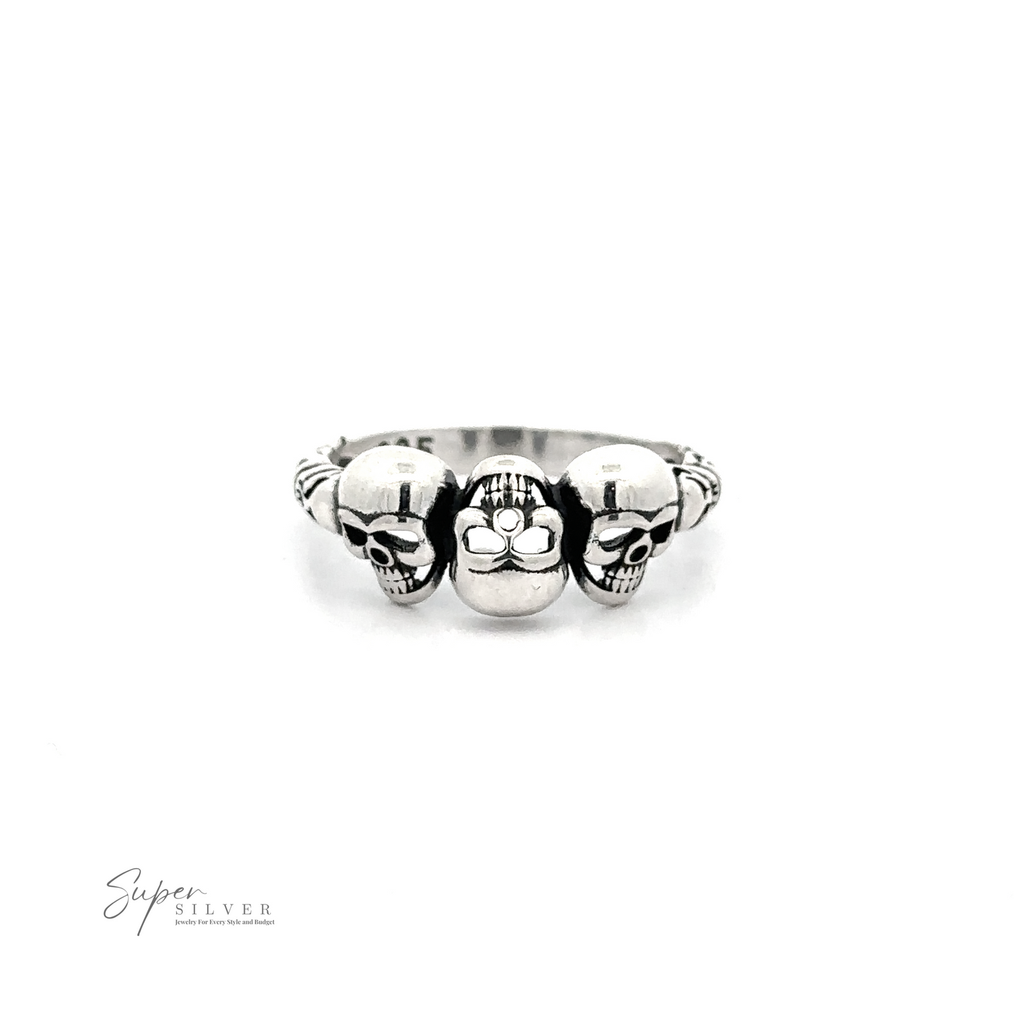 
                  
                    Three Skulls Ring featuring three skulls, with the central skull slightly larger and adorned with a daisy in its mouth, against a white background.
                  
                