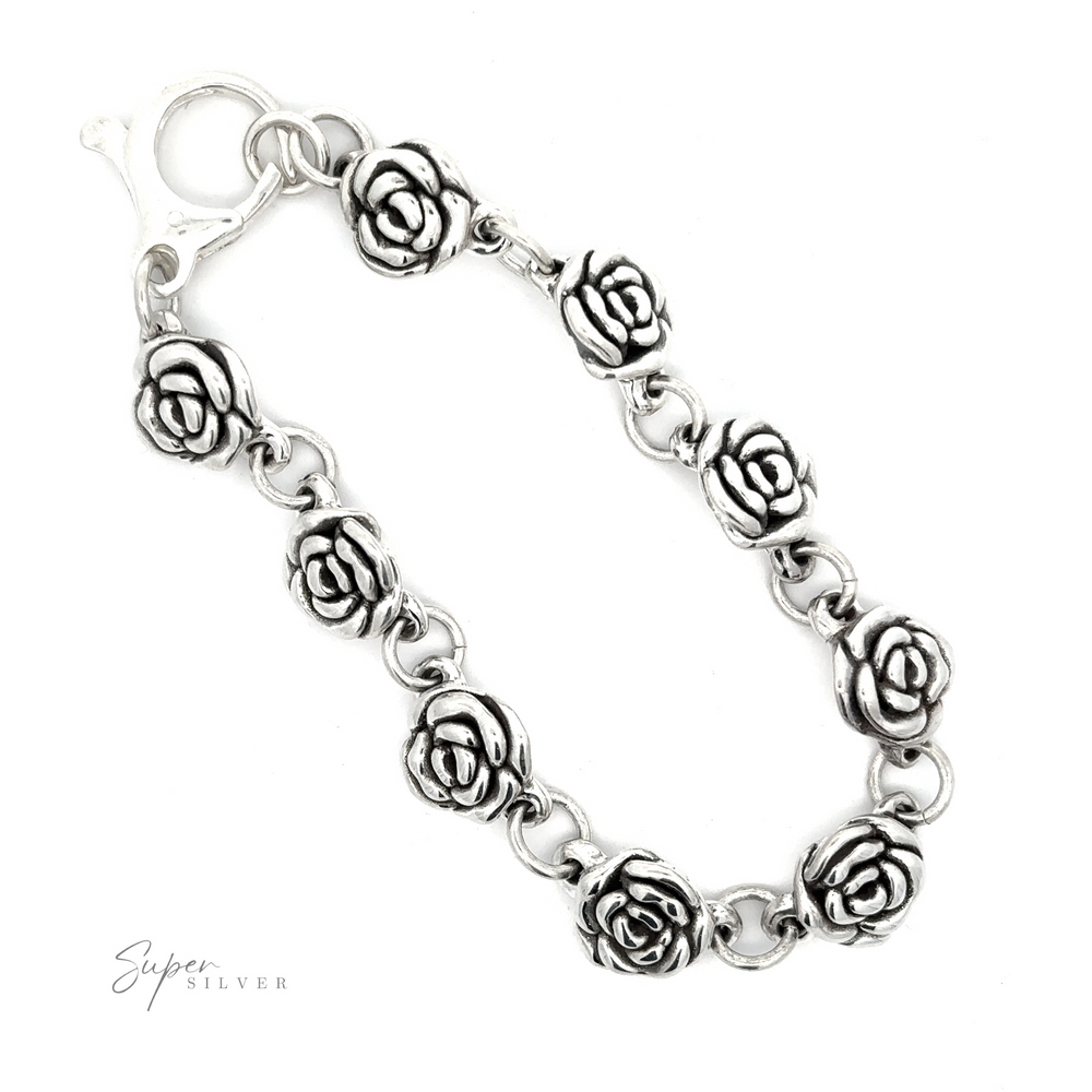 
                  
                    A Chic Link Rose Bracelet featuring ten rose-shaped links and a lobster clasp. The brand name "Super Silver" is visible in the bottom left corner, giving it a subtle vintage vibe.
                  
                