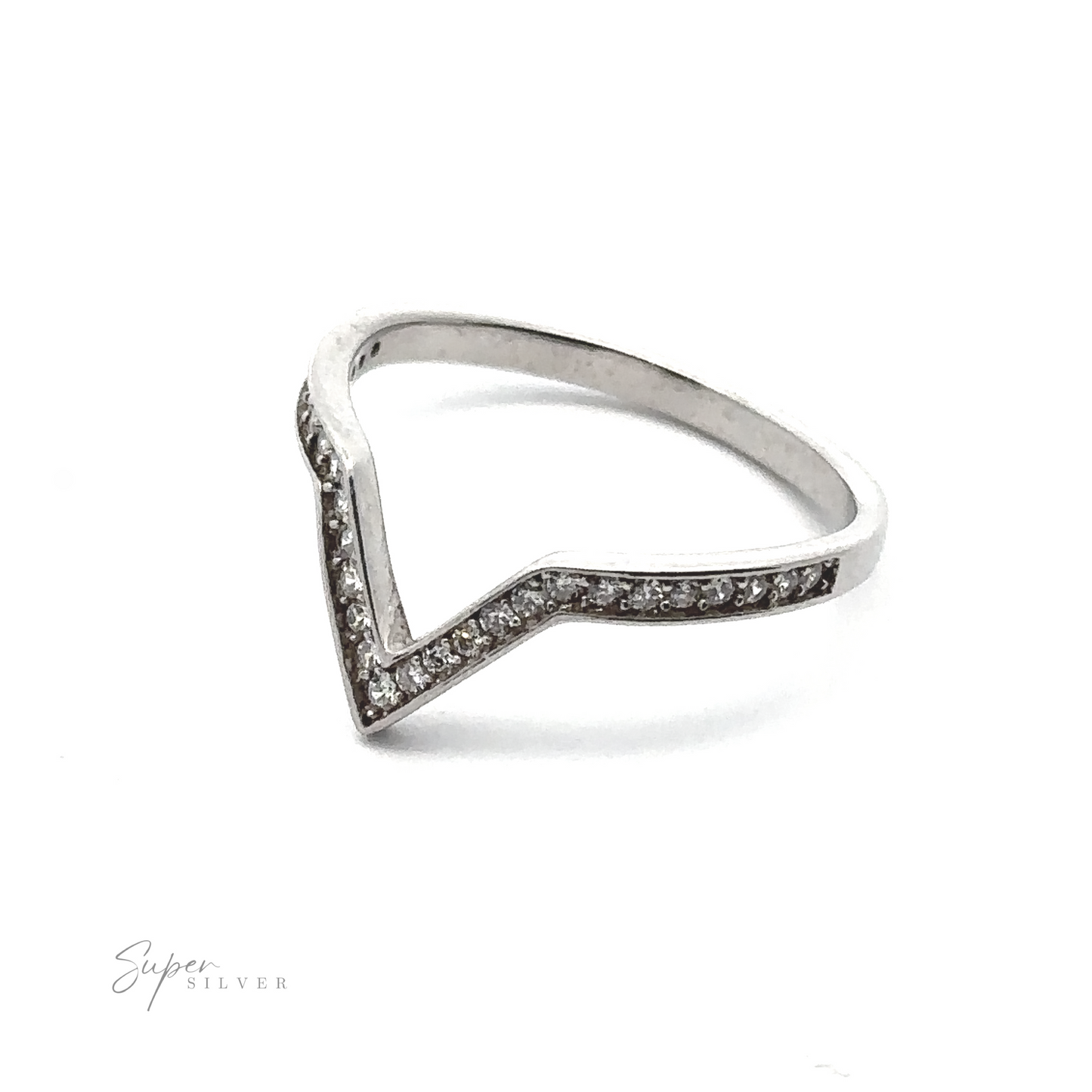 
                  
                    A Channel Set Cubic Zirconia Chevron Ring crafted from rhodium-plated .925 sterling silver with a V-shaped design, encrusted with small diamonds along the top edge. The brand name "Super Silver" is subtly visible in the bottom left corner.
                  
                