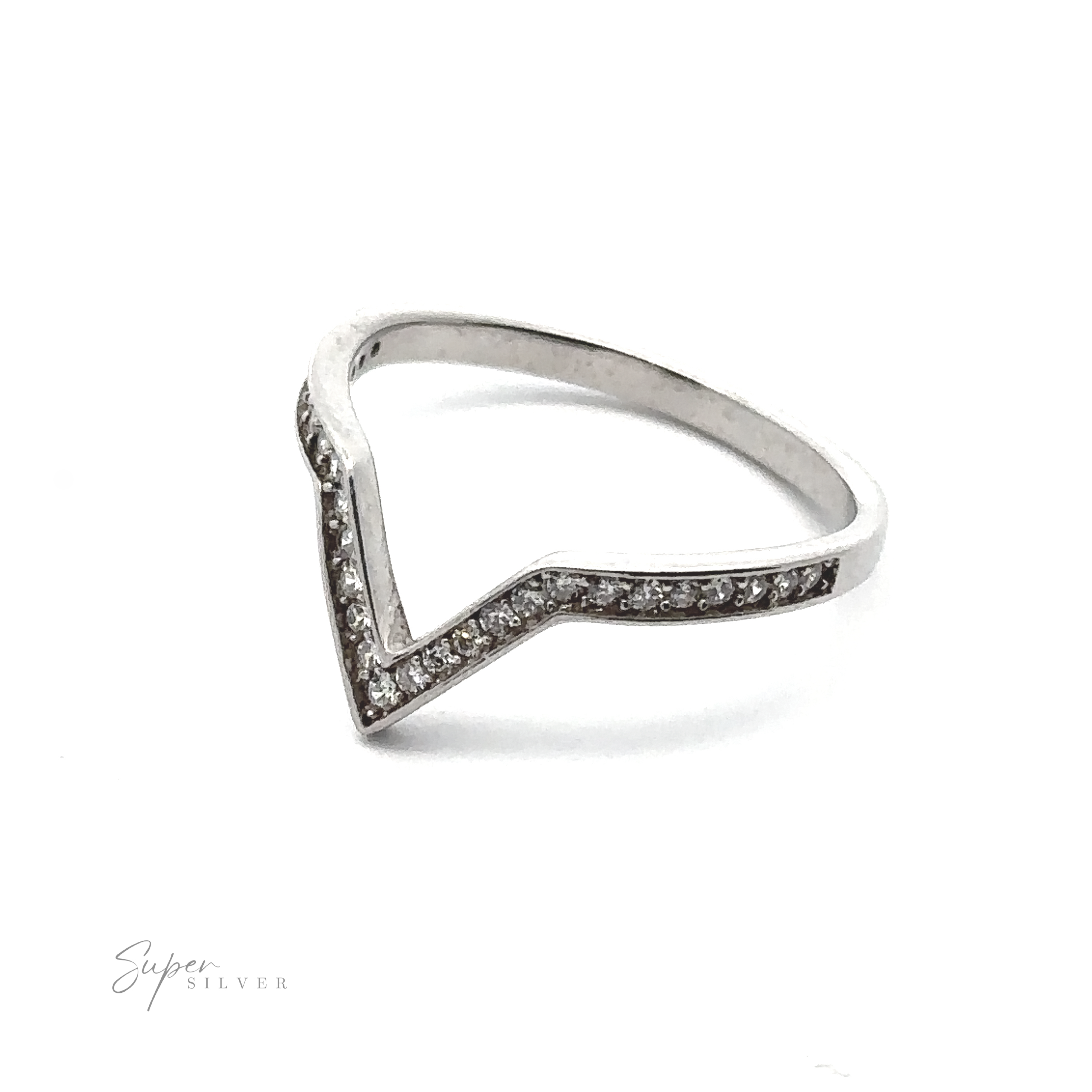 A Channel Set Cubic Zirconia Chevron Ring crafted from rhodium-plated .925 sterling silver with a V-shaped design, encrusted with small diamonds along the top edge. The brand name "Super Silver" is subtly visible in the bottom left corner.