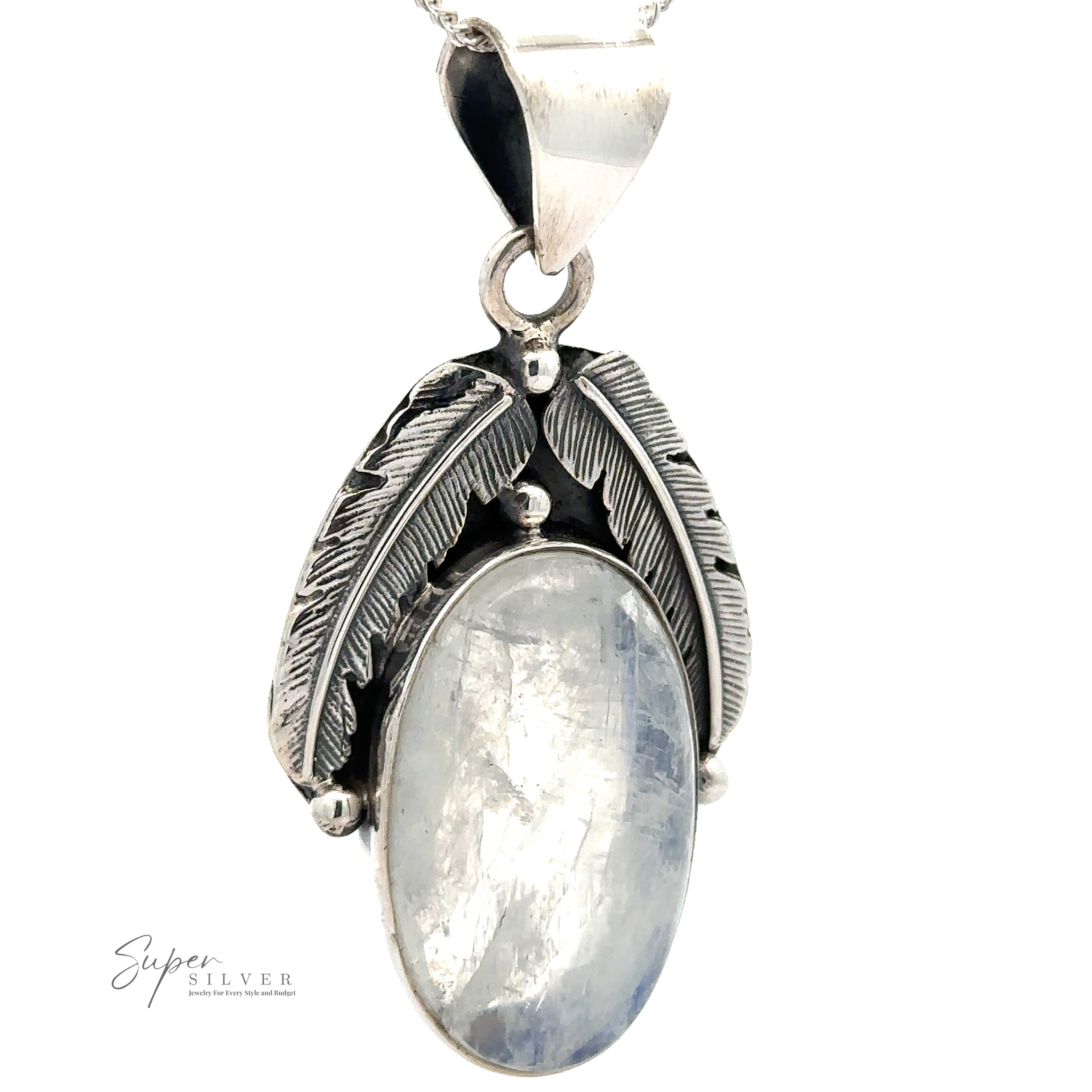 A Beautiful Southwest Stone Pendant features an oval moonstone encased by two silver feather designs and is attached to a silver chain.